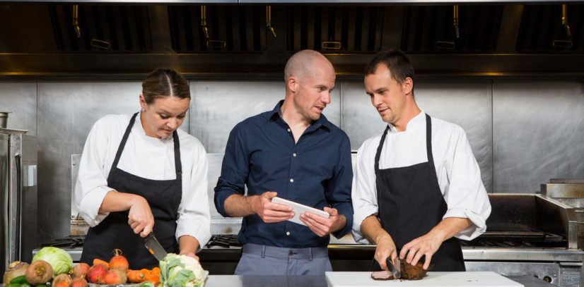 Restaurant manager works with his professional chef's merchant cash advances for restaurants